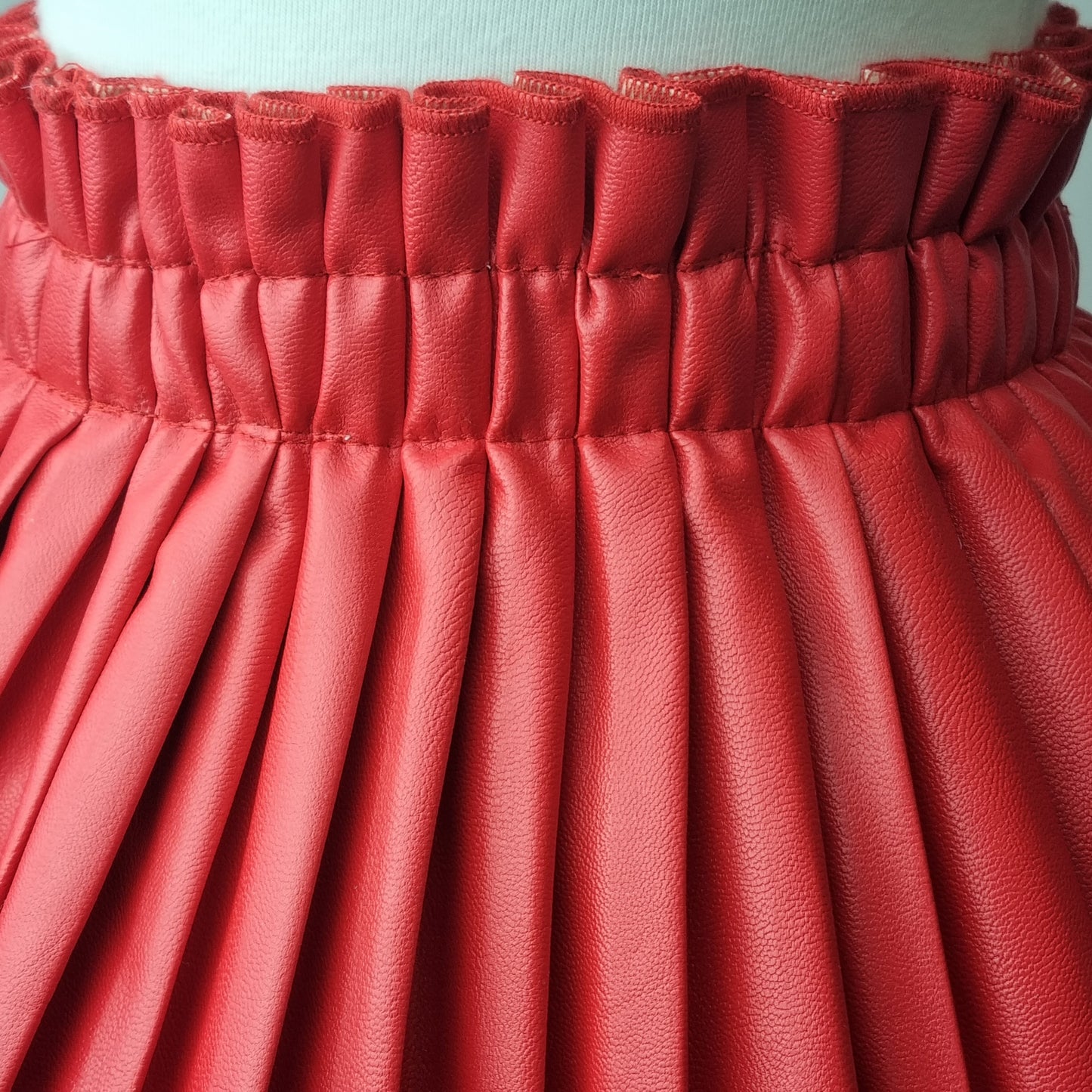 Girls Red Pleated Faux Leather Skirt.